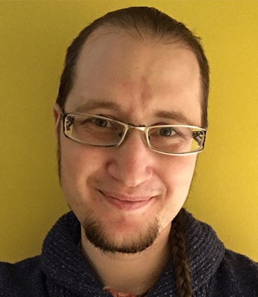 Headshot of Rhys McGovern, MS, CCC-SLP.