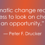A quote graphic with a blue and orange gradient background. The white text reads: "Systematic change requires a willingness to look on change as an opportunity. — Peter F. Drucker"