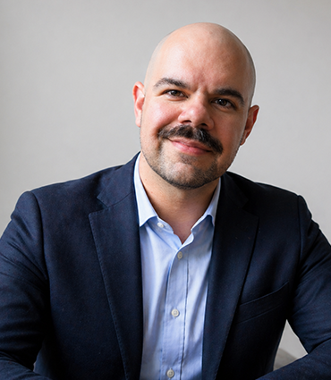 Professional headshot of DT Bruno.