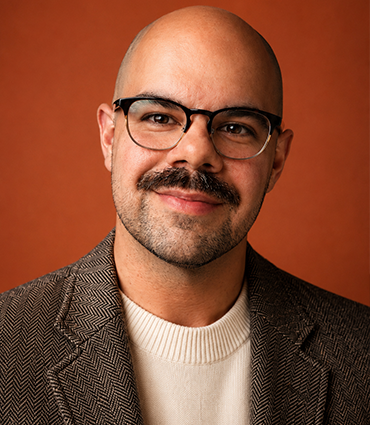 Professional headshot of DT Bruno.